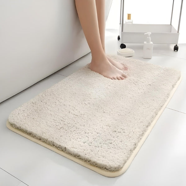 Base antiderrapante do Tapete SoftLux Nomanni, ideal para banheiros e pisos frios, garantindo segurança mesmo com o piso molhado.