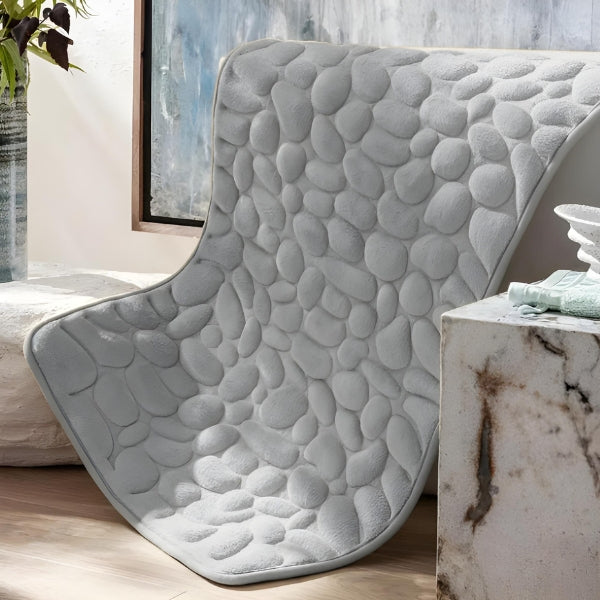 Base antiderrapante do tapete SoftStone, garantindo firmeza e segurança no banheiro para toda a família e pets.