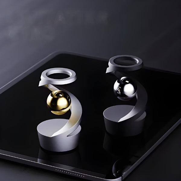 Escultura giroscópica decorativa com movimento contínuo, ideal para mesas de escritório e ambientes modernos.
