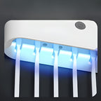 Porta escovas de dentes com luz UV antibacteriana e dispenser automático, acessório moderno para banheiro funcional, seguro e bem organizado.
