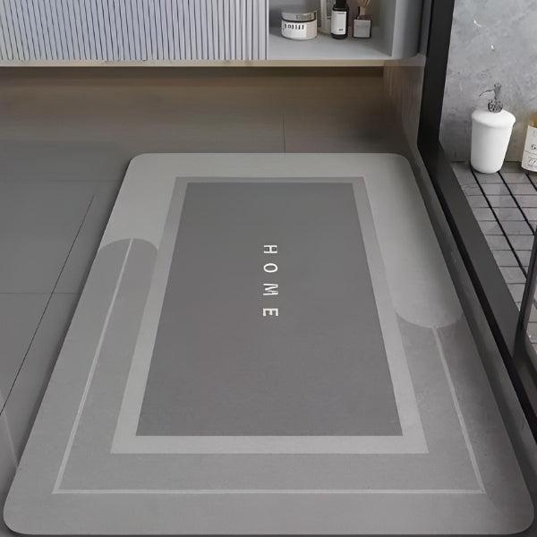 Tapete banheiro com estampa HOME e estilo clean. Combina com qualquer decoração, oferecendo beleza, praticidade e segurança.